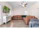 Spacious living room with large sectional, white media center and a ceiling fan at 5026 Adrian Hwy., Conway, SC 29526
