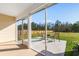 Screened patio with outdoor seating overlooking a spacious fenced backyard at 5026 Adrian Hwy., Conway, SC 29526