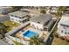 Aerial view of a home with a pool, well-manicured lawn, and white privacy fence at 513 Hillside Dr. S, North Myrtle Beach, SC 29582