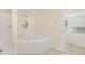 Bathroom showing a jacuzzi tub and the bunk beds through the door at 513 Hillside Dr. S, North Myrtle Beach, SC 29582