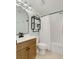 Full bathroom with updated fixtures, including a vanity with a wooden cabinet and a shower-tub combination at 513 Hillside Dr. S, North Myrtle Beach, SC 29582