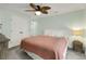 Comfortable bedroom featuring a full size bed, neutral colors, and a decorative woven side table at 513 Hillside Dr. S, North Myrtle Beach, SC 29582