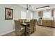 Charming dining area with seating for six, adjacent to the kitchen and featuring wood-look flooring at 513 Hillside Dr. S, North Myrtle Beach, SC 29582