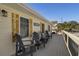 Charming front porch with comfortable seating and tasteful decor at 513 Hillside Dr. S, North Myrtle Beach, SC 29582