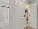 Convenient laundry area featuring a stacked washer and dryer unit and a full bathroom nearby at 513 Hillside Dr. S, North Myrtle Beach, SC 29582