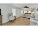 Bright living room with coastal decor, modern furniture, and an open floor plan connecting to the kitchen at 513 Hillside Dr. S, North Myrtle Beach, SC 29582