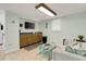 Cozy living room area with kitchenette features seating and natural lighting at 513 Hillside Dr. S, North Myrtle Beach, SC 29582