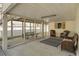 Enjoy the covered outdoor area featuring comfortable seating and a picnic table at 513 Hillside Dr. S, North Myrtle Beach, SC 29582