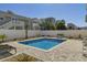 Beautiful backyard featuring a private pool, lounge chairs and a privacy fence at 513 Hillside Dr. S, North Myrtle Beach, SC 29582