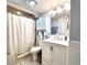 Bright bathroom showcasing a bathtub and shower combo, vanity with mirror and modern lighting at 5523 North Ocean Blvd. # 2112, Myrtle Beach, SC 29577