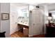 A bathroom features a single sink vanity, a mirror, and a toilet, with 2 white paneled doors at 5523 North Ocean Blvd. # 2112, Myrtle Beach, SC 29577