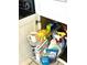 Pull-out kitchen cabinet showcasing cleaning supplies with organized storage racks and white cabinets, offering space-saving solutions at 5523 North Ocean Blvd. # 2112, Myrtle Beach, SC 29577