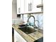 Stainless steel sink and faucet set in bright kitchen with sleek countertops at 5523 North Ocean Blvd. # 2112, Myrtle Beach, SC 29577