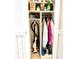 Storage closet with white shelves holding various household items, including a vacuum cleaner and clothing, for organized living at 5523 North Ocean Blvd. # 2112, Myrtle Beach, SC 29577