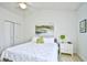 Bedroom featuring white walls, ceiling fan, neutral carpet, and a comfortable bed with green accents at 5650 Barefoot Resort Bridge Rd. # 234, North Myrtle Beach, SC 29582