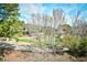 Scenic view of the golf course from the property with trees, green grass, and blue sky at 5650 Barefoot Resort Bridge Rd. # 234, North Myrtle Beach, SC 29582