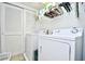 Functional laundry room with white washer and dryer, closet and white walls at 5650 Barefoot Resort Bridge Rd. # 234, North Myrtle Beach, SC 29582