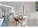 Dining area next to a kitchen with stainless steel appliances and a granite countertop at 601 Retreat Beach Circle # 411, Pawleys Island, SC 29585