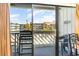 A view from the balcony overlooking palm trees, complex, and neighborhood at 627 North Waccamaw Dr. # 212, Murrells Inlet, SC 29576
