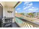 Balcony featuring outdoor seating and views of nearby buildings at 627 North Waccamaw Dr. # 212, Murrells Inlet, SC 29576