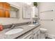 Bathroom featuring double sinks, granite countertops and a mirrored cabinet at 627 North Waccamaw Dr. # 212, Murrells Inlet, SC 29576