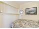 Guest bedroom showcasing a cozy bed, artwork, and a small mirror for added charm at 627 North Waccamaw Dr. # 212, Murrells Inlet, SC 29576