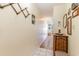 Well-lit hallway with coastal decor, tiled floors, and a welcoming beachy atmosphere at 627 North Waccamaw Dr. # 212, Murrells Inlet, SC 29576