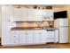 Efficient kitchen featuring white cabinetry, laminate countertops, and essential appliances at 627 North Waccamaw Dr. # 212, Murrells Inlet, SC 29576