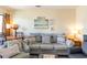 Living room with sofa, chairs, a round table, and neutral-toned decor at 627 North Waccamaw Dr. # 212, Murrells Inlet, SC 29576