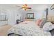 Comfortable main bedroom featuring a large mirror, dresser, and a plush decorative pillow and blanket at 633 White Oak Ln., North Myrtle Beach, SC 29582