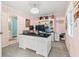 Spacious home office with large desk, built-in shelving, and modern lighting at 633 White Oak Ln., North Myrtle Beach, SC 29582