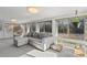 Cozy sunroom with comfortable seating, large windows offering natural light and outdoor views at 633 White Oak Ln., North Myrtle Beach, SC 29582