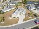 Aerial view of home in a quiet neighborhood near a pond with landscaped yard at 654 Evers Loop, Surfside Beach, SC 29575