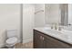 This bathroom features a single sink vanity, toilet and tile floors at 654 Evers Loop, Surfside Beach, SC 29575