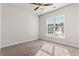 Carpeted bedroom features a ceiling fan and window at 654 Evers Loop, Surfside Beach, SC 29575