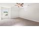 This carpeted bedroom features a window, ceiling fan and vaulted ceilings at 654 Evers Loop, Surfside Beach, SC 29575