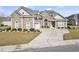 Charming brick home with a well-manicured lawn and a spacious driveway at 654 Evers Loop, Surfside Beach, SC 29575