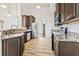 Kitchen features stainless steel appliances, granite countertops, and tile backsplash at 654 Evers Loop, Surfside Beach, SC 29575