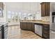 Modern kitchen featuring granite countertops, stainless steel appliances, and wood floors at 654 Evers Loop, Surfside Beach, SC 29575