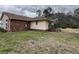 The back exterior features brick and siding, with an access stairwell to the yard at 657 Mulberry Rd., Salters, SC 29590