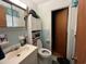 Bathroom with a blue tile, white fixtures, and storage cabinets at 657 Mulberry Rd., Salters, SC 29590