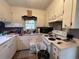 Cozy kitchen featuring white cabinets, laminate counters, and standard appliances at 657 Mulberry Rd., Salters, SC 29590