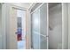 Bathroom interior showcasing a shower with sliding glass doors and the entrance to another room at 762 Wraggs Ferry Rd., Georgetown, SC 29440