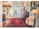 The home features a welcoming foyer with an arched window over the door, hardwood floors, and traditional rugs at 762 Wraggs Ferry Rd., Georgetown, SC 29440