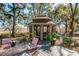 A charming gazebo sits off the deck with picturesque views of the surrounding landscape at 762 Wraggs Ferry Rd., Georgetown, SC 29440