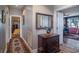 Hallway with hardwood floors, area rug, and a view into the bedroom and living room at 762 Wraggs Ferry Rd., Georgetown, SC 29440