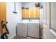 A functional laundry room offers a washer, dryer, and ample storage space at 762 Wraggs Ferry Rd., Georgetown, SC 29440