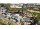 Aerial view of townhouses near golf course, featuring pool and lush greenery at 850 Fairway Dr. # 1003Ee, Longs, SC 29568