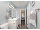 A clean bathroom with dual sink vanity, overhead lighting, and access to the bedroom for convenience at 850 Fairway Dr. # 1003Ee, Longs, SC 29568