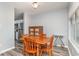 Inviting dining space with wood table, gray flooring, and modern accents at 850 Fairway Dr. # 1003Ee, Longs, SC 29568